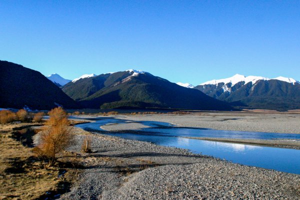 Waimakariri River, mountains in the background on a sunny day